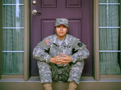 Soldier sitting on a stoop